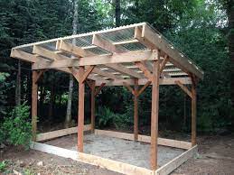 Wood Shed I Built 12x8 No Floor As I Ll Use Pallets And Treated 4x4s Roof Uses Corrugated Poly Beams Are Attached Pergola Entrance Backyard Sheds Backyard