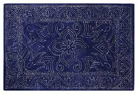 The pebble rug is made from a canvas base layer in jute with woollen loops atop. Coastal Collective Co