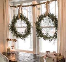 Like clerestory windows, the roman shades on these windows bring in light from above while maintaining privacy. Easy Inexpensive Christmas Window Decoration Ideas For 2020
