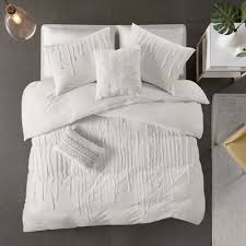 The comforter and shams (1 for twin/twin xl) feature a printed, overscaled floral motif that is set to one side on a bright white backdrop. Bedding Sets Target