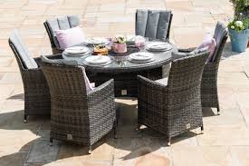 Ideal For Sophisticated Alfresco Dining This Six Seat Dining Set Is Made From Flat Weave Rattan F Round Dining Table Sets Round Dining Set Rattan Dining Table