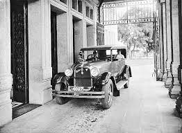 De Heer A Van Der Eyk Zittend Achterin Een Auto Met Een Javaanse Chauffeur Soerabaja 1931 Indonesia