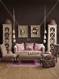 Living Room In Natural Shades With Dark Brown Wall Pink Scatter Cushions And Lilac Rug Add Cheerful Brown Walls Living Room Pink Living Room Dark Brown Walls
