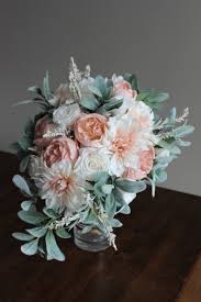A loose bouquet comprised of dahlias, garden roses, astilbe, eucalyptus, and foraged greenery arranged by sofia of branco prata studios. 7nwefo 6ot7f7m