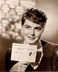 Ingrid Bergman wears a midi-skirt suit and a wide-brimmed hat. "Casablanca"  (1942) Costume Designer: Orry-Kelly