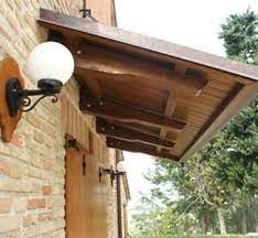 Also know, how far can you cantilever a 2x6 roof? Roofing To Cover Doors Stairways And Windows By Tecnowood Cantilever Porch Cantilever Porch Roof Shed Roof Porch