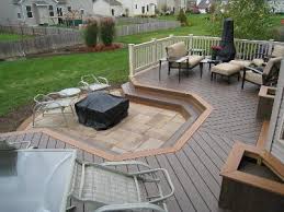 Start by laying out the stone for the fire pit, then mortar it all in place. Low To Grade Decks Columbus Decks Porches And Patios By Archadeck Of Columbus