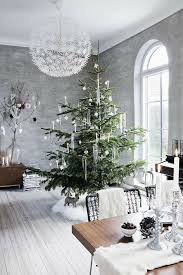 The easiest idea is to leave the tree as it is. 53 Wonderfully Modern Christmas Decorated Living Rooms Modern Christmas Decor Beautiful Christmas Modern Christmas