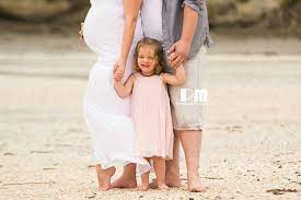 Cute Family Maternity Photo On The Beach With Toddler Photography By Rikki Lee Wrigh Family Maternity Photos Family Maternity Pictures Beach Maternity Photos