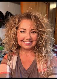 Posing with my natural hair. Yes this is my natural curly hair :-)