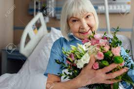However, hospital policies for any given facility may restrict the delivery or presence of flowers depending on the patient's specific illness. Happy Recovering Senior Woman On Bed With Flowers In Hospital Stock Photo Picture And Royalty Free Image Image 116322702