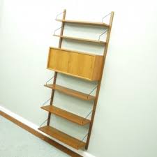 This shelving unit with clean lines, and a high gloss lacquered finish is available in several sizes, colours and finishes. Mid Century Walnut Wall Shelf By Poul Cadovius For Cado 98242