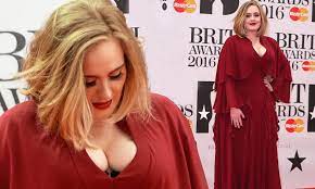 Adele arrives at BRITs 2016 red carpet in busty caped scarlet gown | Daily  Mail Online