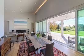 The collection is offered in two color options black metal legs with black glass top or white metal legs with clear glass top for the perfect fit in your casual. Ultra Modern Modern Dining Room New York By Seifert Construction
