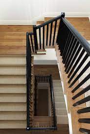 This Coastal Cottage Style Home Boasts Inviting Interiors In Minnesota In 2021 Wooden Staircases Wooden Railing Stairs Wooden Staircase Railing