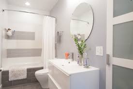 New crown molding, window casings, taller baseboards and white wood blinds made impact to the small room. Gray And White Bathroom Houzz
