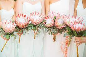 8 Nail Polish And Bridesmaid Dress Color Combos You And Your Girls Will Love Protea Wedding Wedding Flower Guide Protea Bouquet Wedding