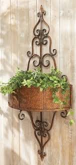 At 18 in diameter, it will hold an abundance of plants or flowers and hangs by the heavy wire that completes the circular design. The Fatal Gift Of Beauty Wall Planter Tuscan Decorating Plant Stands Outdoor
