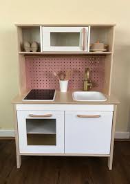 Ikea Duktig Play Kitchen Makeover By Dori Diy Pegboard Backsplash Painted Fixtures Custom Wooden Cab Ikea Play Kitchen Wooden Cabinet Pulls Pegboard Kitchen