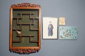 11 the brown rice runs through two huller machines that remove the outer bran layers from the grain. A Chinese Carved Wood Wall Display Two Rice Paper Painting Albums And A Portrait 19 20th C Rob Michiels Auctions
