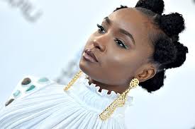 Split your hair into triangular sections. 15 Celebrities Who Have Put Their Own Twist On The Bantu Knot Hairstyle W24