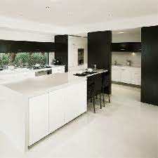 This beautiful contemporary gray and white kitchen offers a large open plan layout with an island big enough to seat three eat in diners. High Gloss Floor Wall Tiles Shiny Polished Porcelain Tile