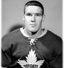 Tim Horton, was a Canadian professional hockey player who played 24 seasons  in the NHL. Today he is best known as the co-founder of the Tim Hortons  restaurant chain. This photo dates
