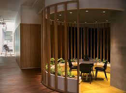 This Office S Interior Design Included Plenty Of Semi Private Circular Seating Areas Areas Private Office Design Interior Design Boards Green Office Design