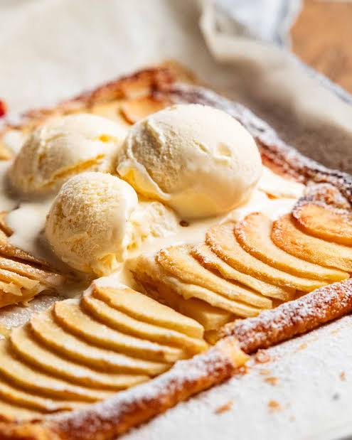 Easy French Apple Tart served with a scoop of vanilla ice cream