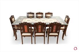 An oval dining table offers a seating. How To Select And Buy The Right Dining Table For Your Home