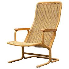Dirk Van Sliedregt Rattan Lounge Chair With Wood Arms Rattan Lounge Chair Chair Leather Dining Room Chairs