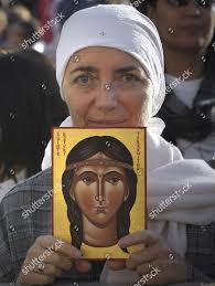 Woman Holds Painting Representing Kateri Tekakwitha Editorial Stock Photo