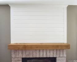 Pallet wall and shiplap wall in the farmhouse kitchen. Modern Rustic Fireplace Makeover How To Add Shiplap