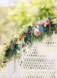 The gorgeous bouquet in #9. Natural Bohemian Wedding Inspiration Bright Australian Native Flowers Peacock Chair The Wedding Playbook
