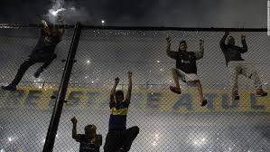 River plate fans clashed with police before the original game on saturday, when the boca juniors bus was attacked. Boca Juniors Thrown Out Of Copa Libertadores Cnn