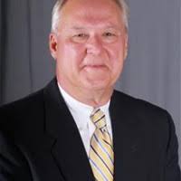 Kayla Digby, President of Voyager Express, located in Denver, CO, accepts  an appreciation plaque for inviting Marketplace Cares to serve the  employees and drivers of Voyager Express.