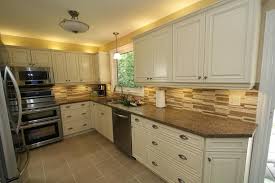 Cream kitchen cabinets with black countertop. Cream Kitchen Cabinets Cream Kitchen Cabinets With Stainless Steel Appliances Design Cream Kitchen Cabinets Kitchen Cabinet Design Kitchen Cabinets Pictures