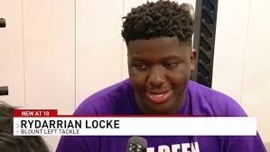 Blount High School football players baptized together as a team