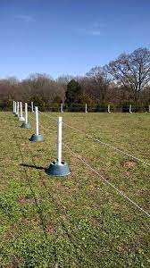 Diy Riding Arena... Christmas Tree Stands, Concrete, Pvc Pipes, And Rope.  Arena Is 200X75 And All For Under $350! Great … | Horse Shelter, Riding  Arenas, Horse Pens