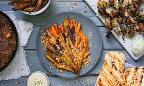 Warm hummus with pine nuts, raisins and olives Host A Vegan Dinner Party With These Tasty Vegan Recipes Crush