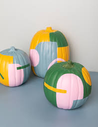 You might be able to spray paint your pumpkins if the coating on the foam is durable; Art Deco Painted Pumpkins Oh Joy