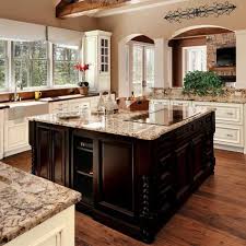 Tuscan Kitchen Style Using Granite Countertops And Induction Cooktop Over White Cabinets Kitchen Remodel Countertops Tuscan Kitchen Kitchen Island With Cooktop
