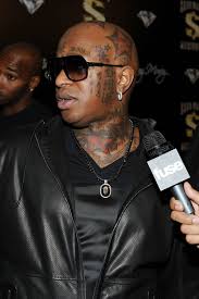 Birdman has a cross tattooed on his face, right between his eyes. Ready For A New Image Birdman Removing His Facial Tattoos