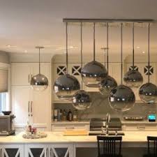 A chandelier is a key opportunity to make a big design statement. Sculptural Glass 7 Light Linear Chandelier S M Globe Silver Ombre Shade Modern Dining Room Lighting Living Room Light Fixtures Dining Room Chandelier Modern