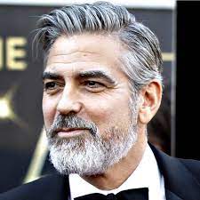 Slicked over side part george clooney haircut source The Best George Clooney Haircuts Hairstyles 2021 Update