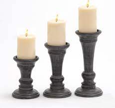 Topotdor classic elegant pillar candle holders set of 3, black resin candlestick holders for romantic wedding , candlelight dinner,special events,home decor. Set Of 3 Wood Pillar Candle Holders In Matte Black Grey 10 8 And 6 Inches High Buy Online In Qatar At Qatar Desertcart Com Productid 67131906