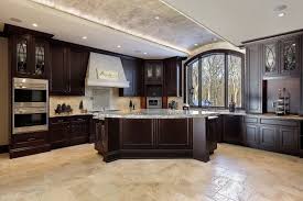 This kitchen incorporates a variety of different styles, yet it works so well because the dramatic black cabinets tie the look together. 27 Beautiful Photos Of Dark Cabinet Kitchen Designs You Ll Love