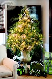 Small Christmas Tree In An Urn Love The Colors On The Wrapped Packages Small Christmas Trees Small Christmas Trees Decorated Holiday Decor