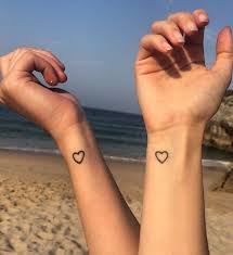 First Tattoo Placement On Hand Wrist 42 Tiny Hand Wrist Tattoo Ideas For Woman Matching Bff Tattoos Small Heart Tattoos Tiny Heart Tattoos