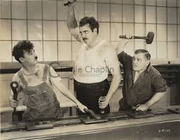 Themes include integrity and perseverance. Charlie Chaplin Filming Modern Times